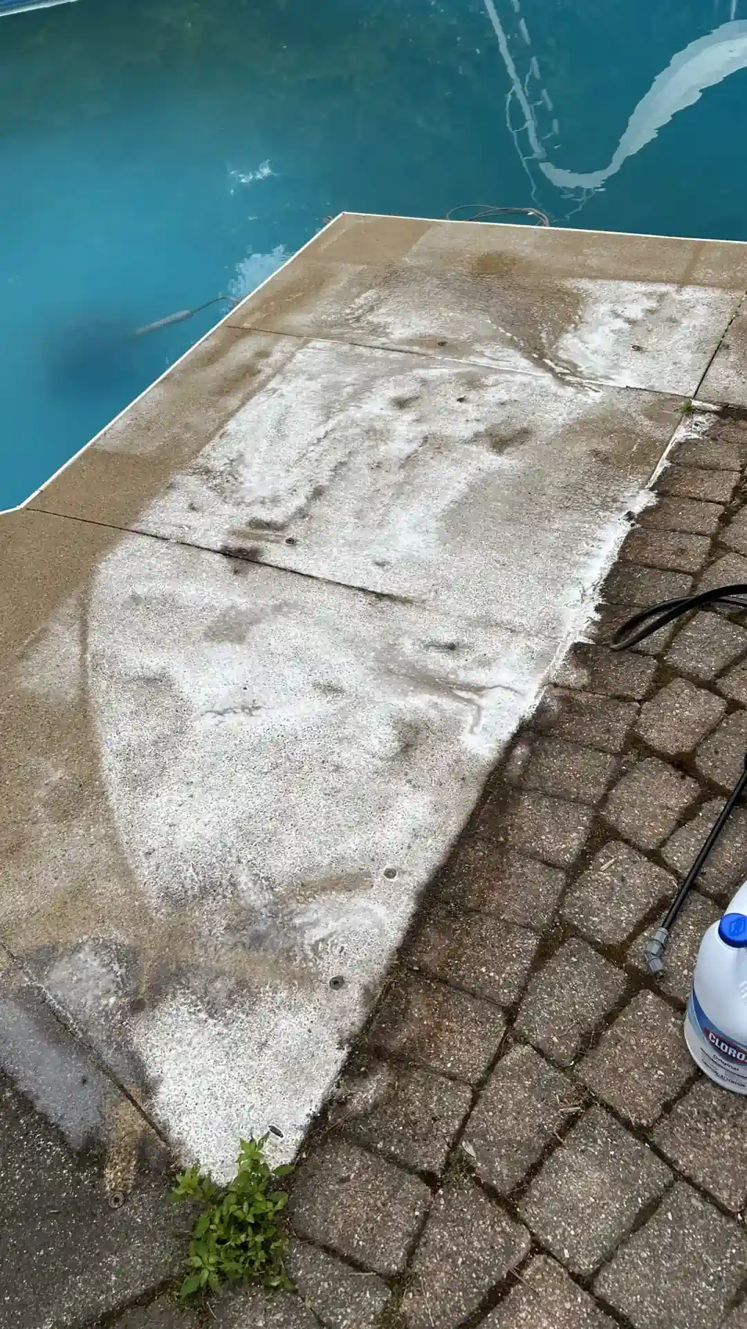 Pressure washing a concrete driveway in Kitchener Ontario